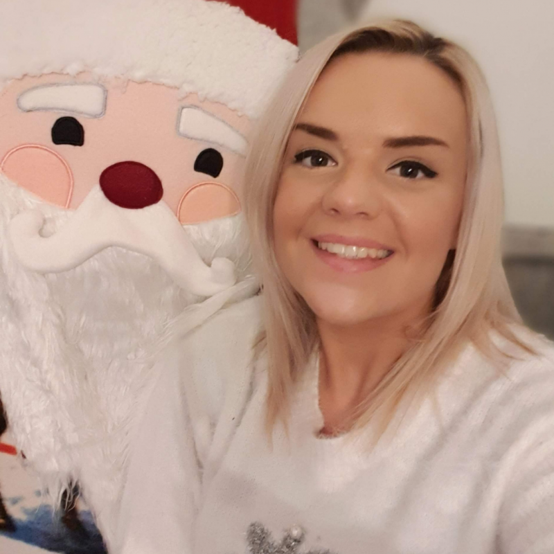 Person smiles, Santa plush