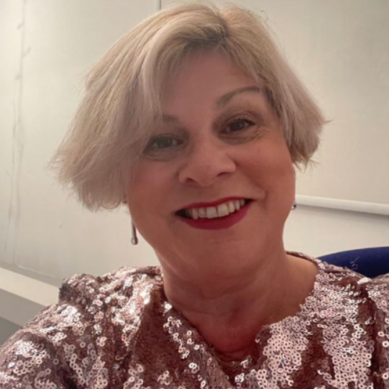 Person smiles, sequin top