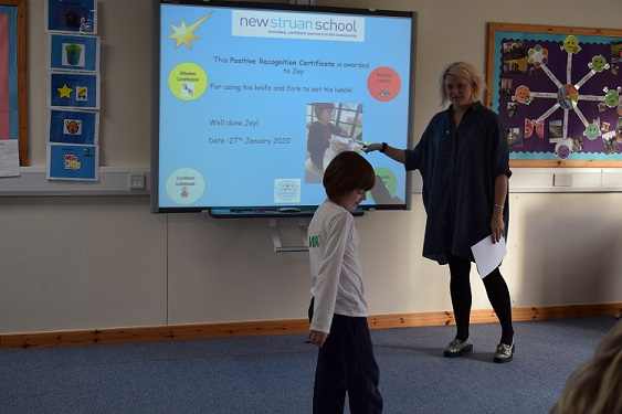 Boy receiving certificate