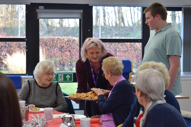 Serving up cakes for the Festive Afternoon Tea