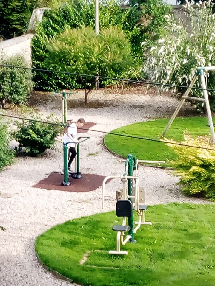 Kenneth (service user) independently using equipment while in garden.