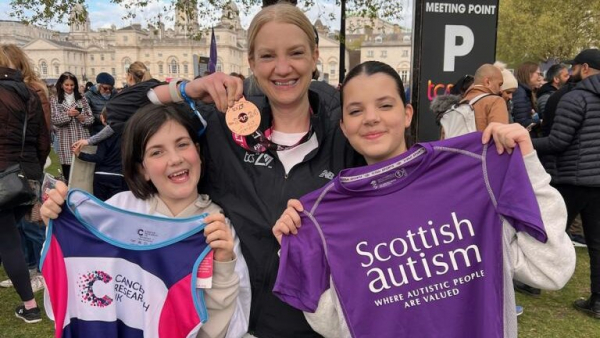 Joanna and her two daughters after completing the London Marathon. 