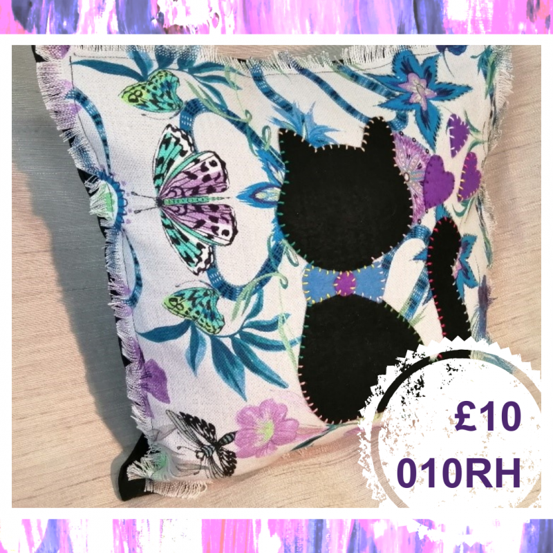 A small square cushion with a cat, £10, 010RH