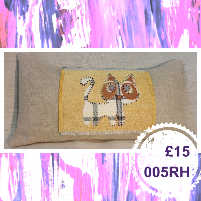 A long cushion with an animal, £15, 005RH