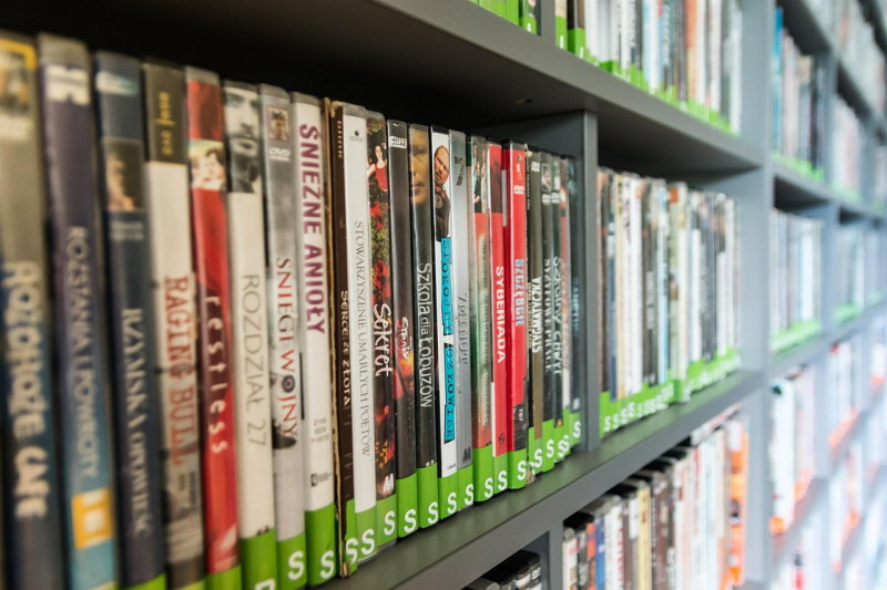 Library of dvds displayed on a shelf
