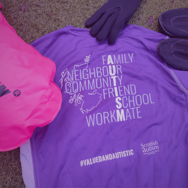 Image of a supporter tshirt, swimming items, outdoors, grass