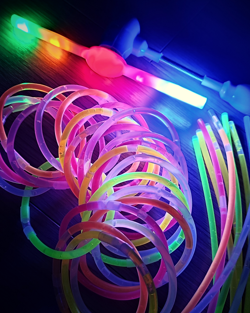 A collection of light up toys and glow sticks