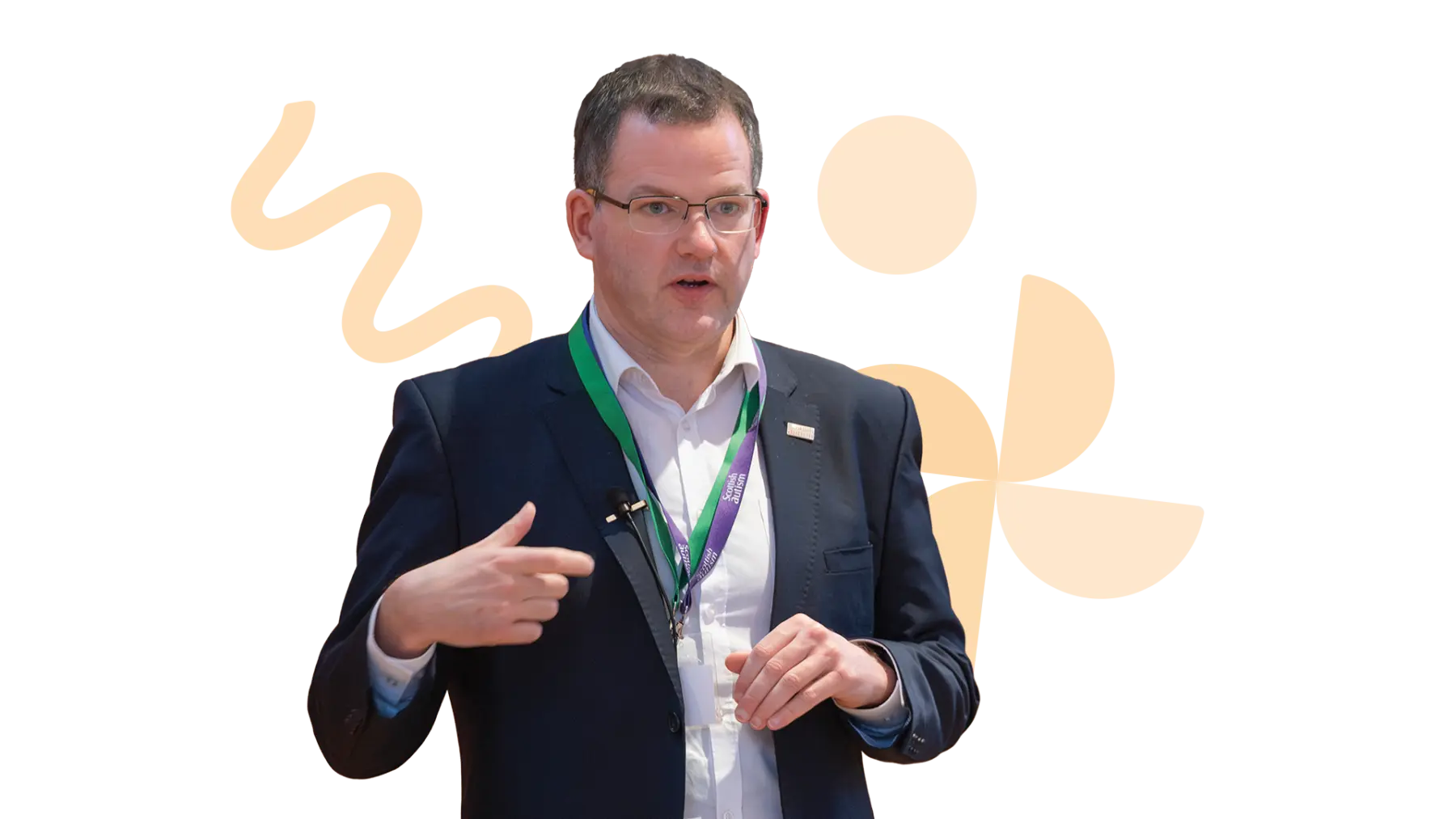 Image is of someone wearing a suit and talking. Blue shapes are behind them