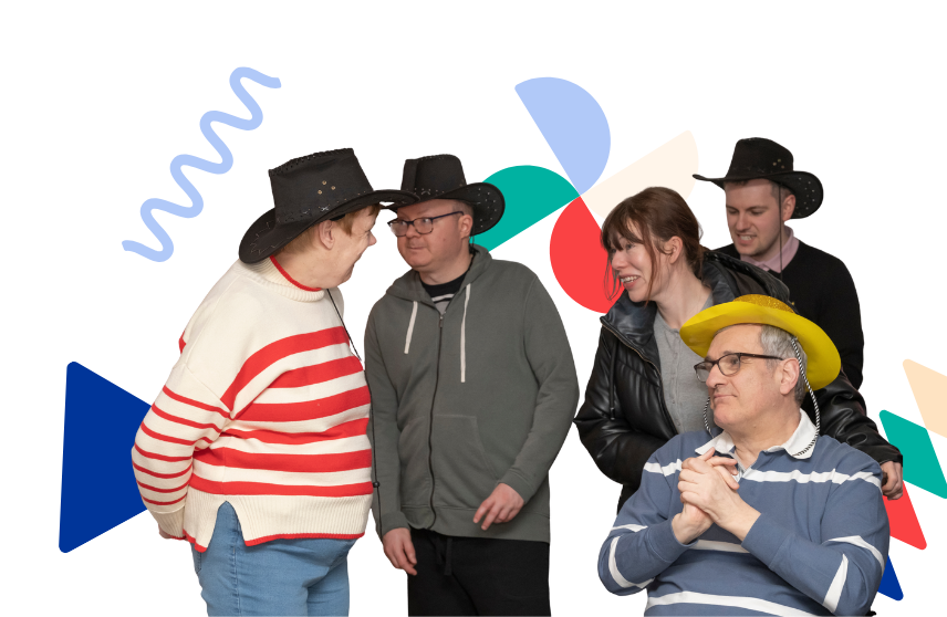 Image of 5 people talking to one another at an event, smiling too