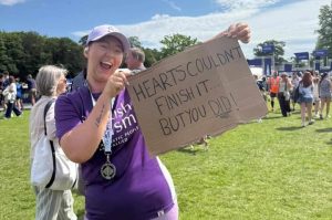 Image of a Scottish Autism supporter with a big smile having completed the Edinburgh Marathon