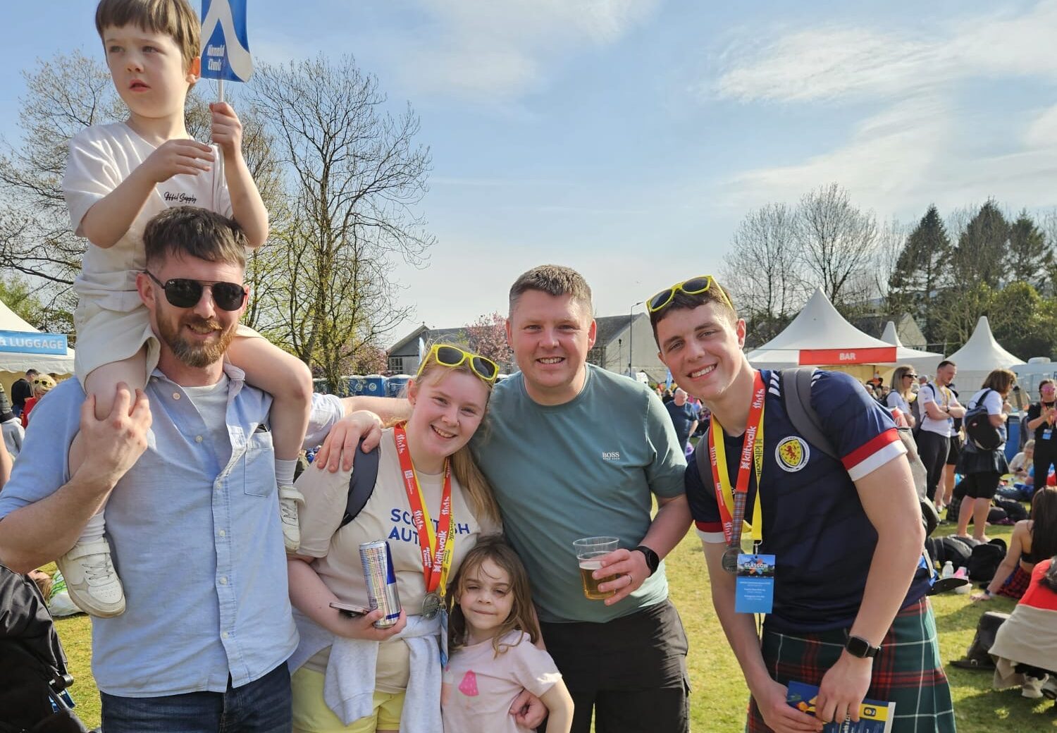A group of Kiltwalk walk supporters come together and smile for the camera