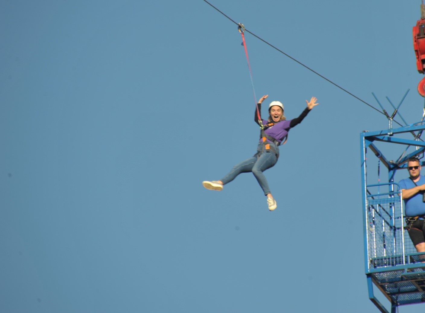 Image of a person ziplining across a wire
